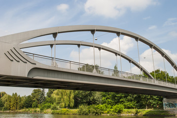 Bridge under cloudy sky