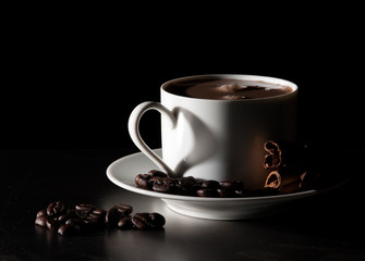 Coffee love. Warm cup of coffee on black background