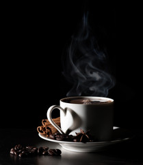 Coffee love. Warm cup of coffee on black background