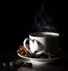 Coffee love. Warm cup of coffee on black background
