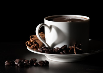 Coffee love. Warm cup of coffee on black background