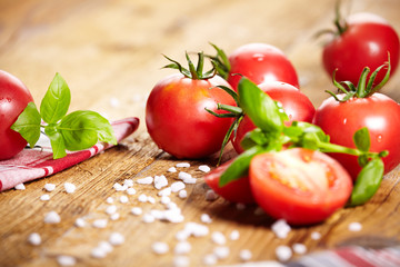Tomatoes lying on old table. Diet food