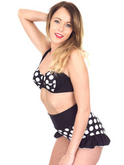 Fototapeta premium Young Woman Wearing Black Polka Dot Bikini