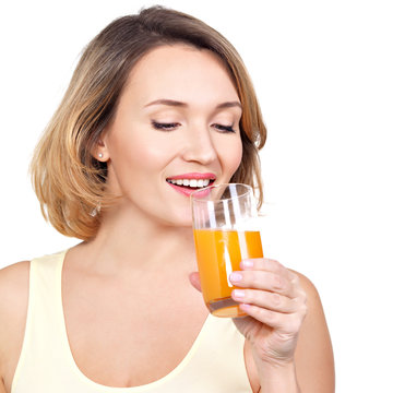 Portrait of a beautiful young woman with a glass of orange juice