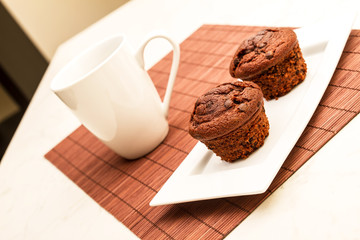 Chocolate Muffins with a cup of coffee