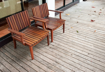 Fototapeta na wymiar Adirondack wood chairs on a cabin porch