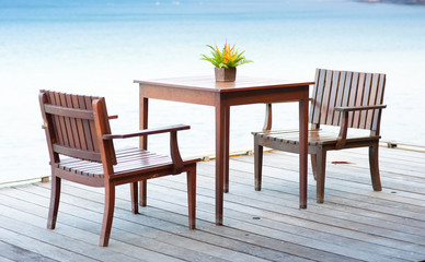 Terrace sea view with outdoor wood chairs and table