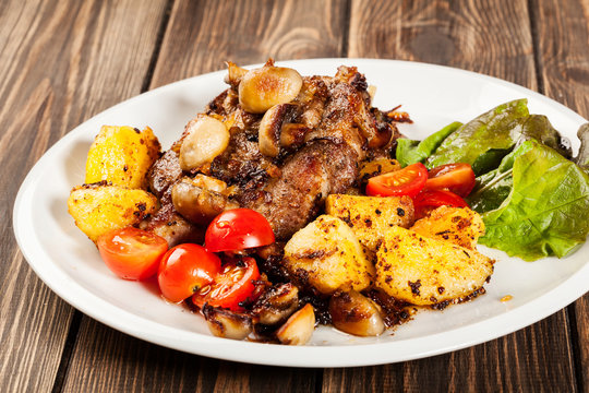 Fried pork chop with mushrooms and chips