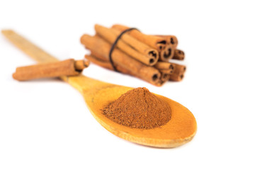Milled cinnamon on wooden spoon