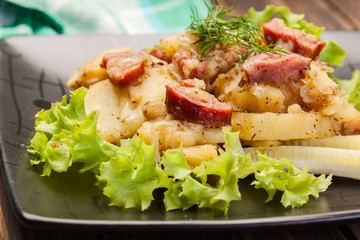 Scalloped potatoes with sausage and bacon