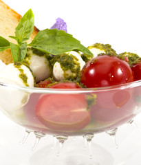 tomatoes and cheese on white plate in a restaurant