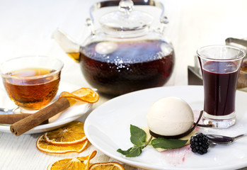 dessert, a piece of cake on the table with a cup of tea