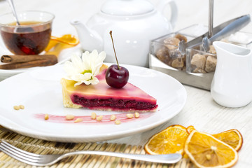 piece of cherry pie on a table in a restaurant