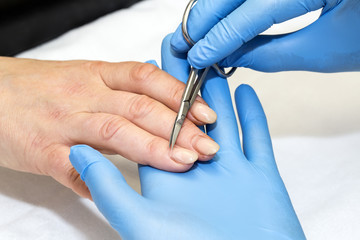 woman doing manicure beauty salon varnish wellness