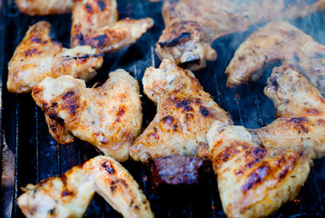Closeup on chicken on grill