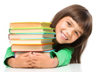 Little girl with her books