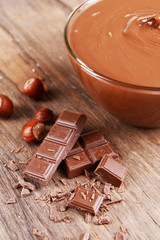 Sweet chocolate cream in bowl on table close-up