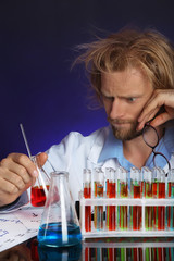 Crazy scientist working in laboratory