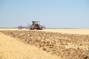 Fototapeta premium tractor with a plow