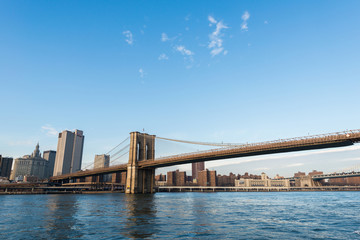 Brooklyn bridge in New York on bright summer day