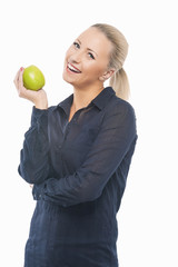Dental Health Concept: Causasian Blond Female with Green Apple i