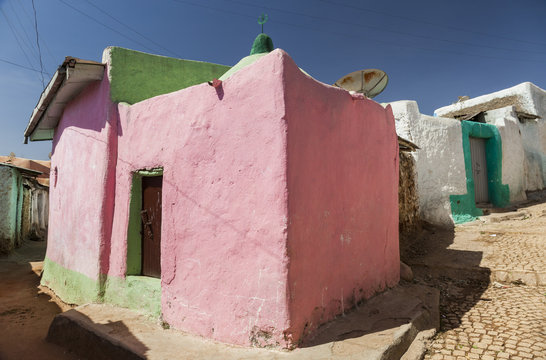 Pink house in narrow alleyway of ancient city of Jugol in the mo