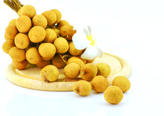 Naklejka na ściany i meble longan fruits and chopping block on white background