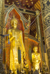 gold Buddha  statue in temple of Thailand.