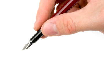 Hand holding a pen (writing or signing) isolated