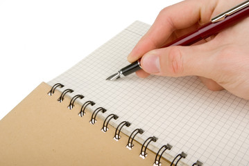 Hand writing on empty notepad (notebook) isolated on white