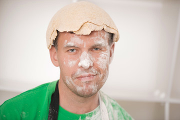 Funny handsome man with dough