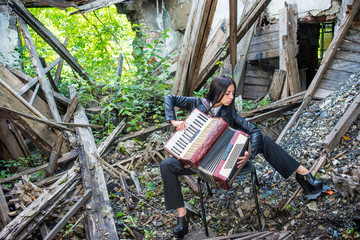 Beautiful woman with accordion and chess