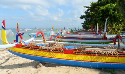Colorful traditional fishing boats on Sanur Beach, Bali.