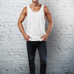 man wearing sleeveless shirt