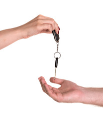 Woman giving car key to man
