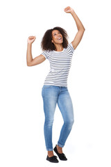 Obraz na płótnie Canvas Cheerful young woman with arms raised