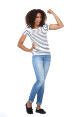 Fototapeta premium Young woman flexing arm muscle