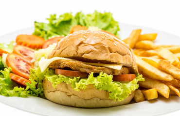 Closeup of home made chicken burgers on plate (Selective Focus)