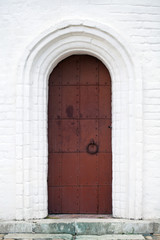 Steel door with white stone arch