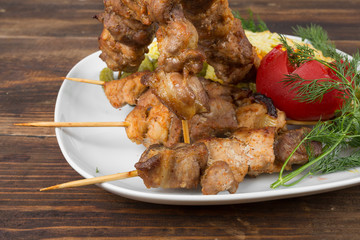 mixed barbecue pork and cucumbers tomatoes and greens