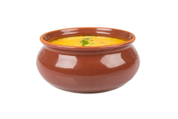 cheese soup in a brown bowl