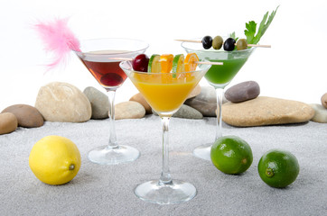 Cherry cocktail in a environment of sand and pebble stones