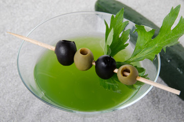 Cherry cocktail in a environment of sand and pebble stones