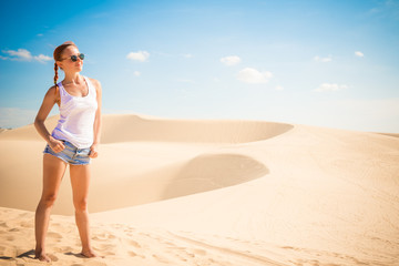 Beautiful woman in sand dunes
