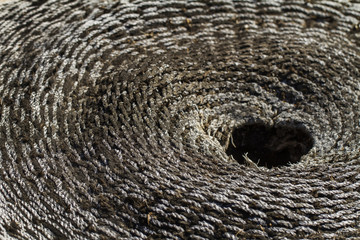 Close view of an old and weathered concentric wicker material.