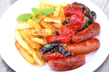 Grilled sausages and fried potatoes