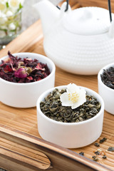 dry herbal teas and kettle of freshly brewed tea