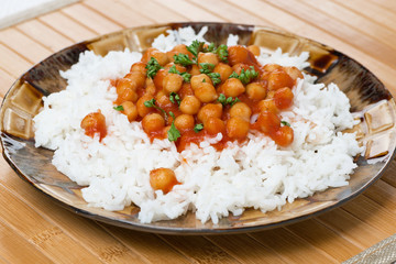 rice with chickpeas in tomato sauce, close-up