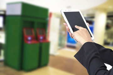 Hands are holding the tablet for banking transactions on-line.