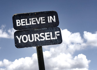 Believe in Yourself sign with clouds and sky